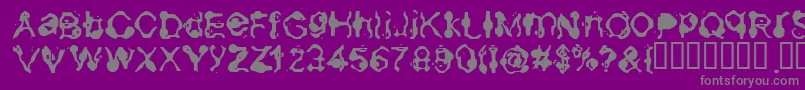 Aneurysm-fontti – harmaat kirjasimet violetilla taustalla