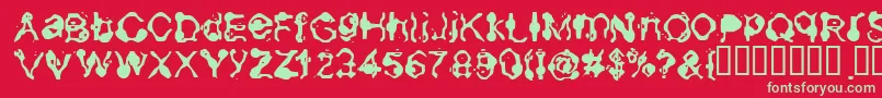 Aneurysm-Schriftart – Grüne Schriften auf rotem Hintergrund