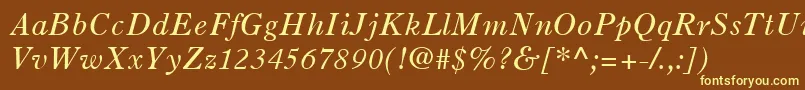OldStyle7LtItalic-fontti – keltaiset fontit ruskealla taustalla