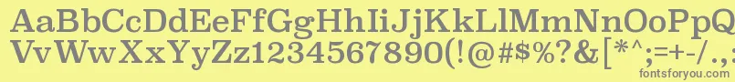 SuperclarendonrgRegular-fontti – harmaat kirjasimet keltaisella taustalla