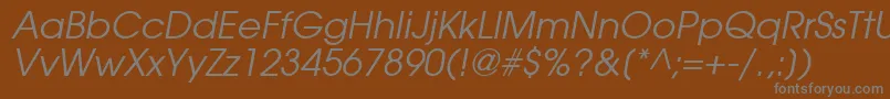 TrendexSsiItalic-fontti – harmaat kirjasimet ruskealla taustalla