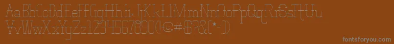 VloderstoneLiteBeta1-Schriftart – Graue Schriften auf braunem Hintergrund