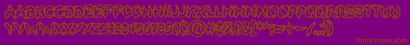 Fonte Kicktotheface – fontes marrons em um fundo roxo