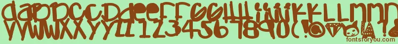 Adamskihand-fontti – ruskeat fontit vihreällä taustalla