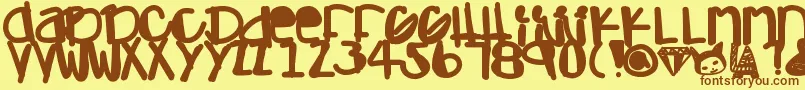 Adamskihand-fontti – ruskeat fontit keltaisella taustalla
