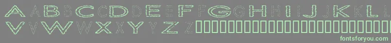 SlurCrumb-Schriftart – Grüne Schriften auf grauem Hintergrund