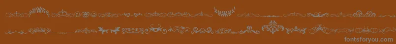 VintageDecorativeSigns5 Font – Gray Fonts on Brown Background