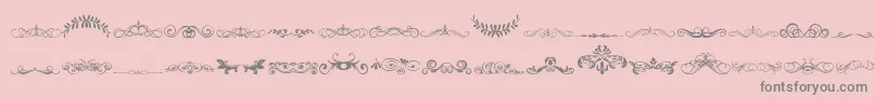 VintageDecorativeSigns5 Font – Gray Fonts on Pink Background