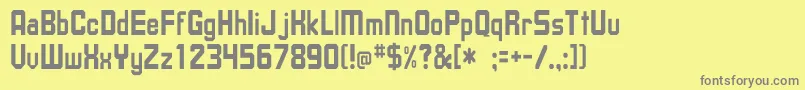 フォントUpsilonTh – 黄色の背景に灰色の文字
