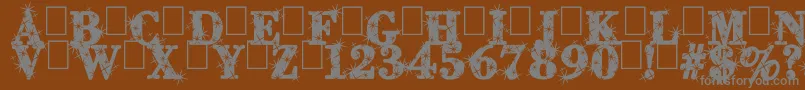 CityOfLight-fontti – harmaat kirjasimet ruskealla taustalla