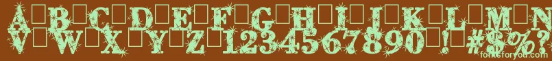 フォントCityOfLight – 緑色の文字が茶色の背景にあります。