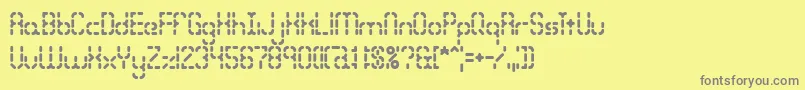 フォントBleakseg – 黄色の背景に灰色の文字