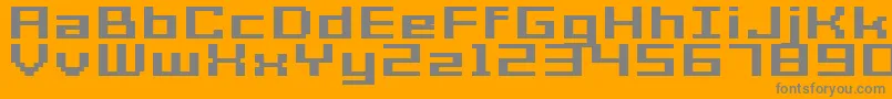 GrixelAcme7WideBoldXtnd-fontti – harmaat kirjasimet oranssilla taustalla
