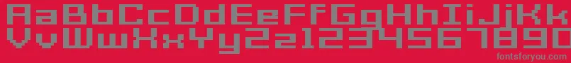 GrixelAcme7WideBoldXtnd-fontti – harmaat kirjasimet punaisella taustalla