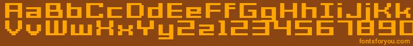 GrixelAcme7WideBoldXtnd-fontti – oranssit fontit ruskealla taustalla