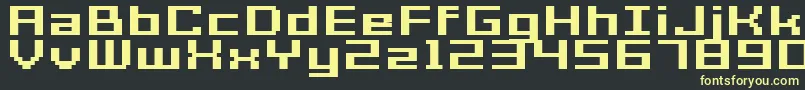 GrixelAcme7WideBoldXtnd-fontti – keltaiset fontit mustalla taustalla