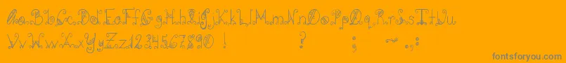 Pcgothicscroll Font – Gray Fonts on Orange Background