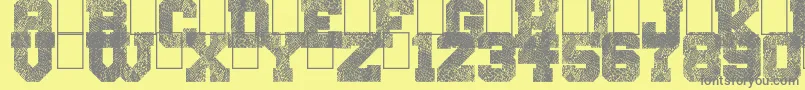フォントSnakeJacket – 黄色の背景に灰色の文字