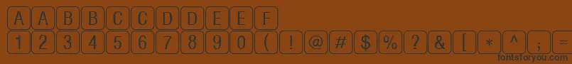 RrkeylettersNormal Font – Black Fonts on Brown Background