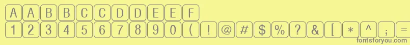 RrkeylettersNormal Font – Gray Fonts on Yellow Background