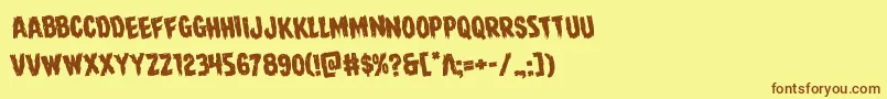 フォントDirewolfrotate – 茶色の文字が黄色の背景にあります。