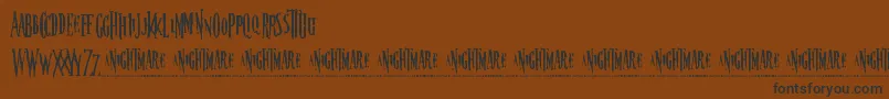 Nightmare5-Schriftart – Schwarze Schriften auf braunem Hintergrund