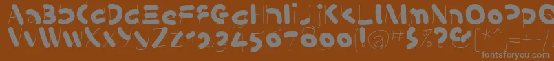 フォントKleinsSausages – 茶色の背景に灰色の文字