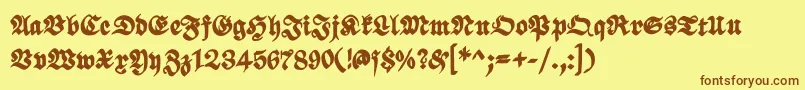 フォントScribbledfrakturXheavy – 茶色の文字が黄色の背景にあります。