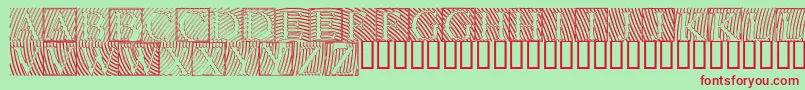 Lowengravedcapshollow Font – Red Fonts on Green Background