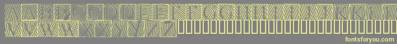 Lowengravedcapshollow Font – Yellow Fonts on Gray Background