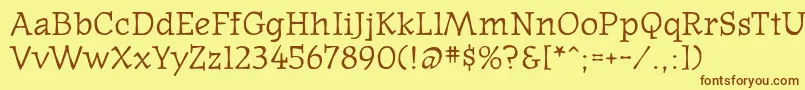 フォントOldnews – 茶色の文字が黄色の背景にあります。