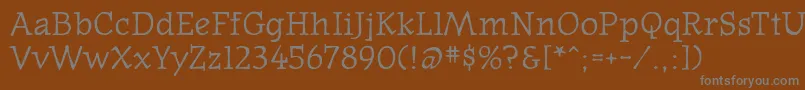 フォントOldnews – 茶色の背景に灰色の文字