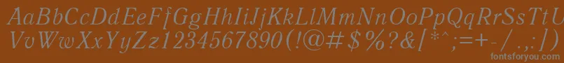 Więcej informacji o czcionce AntiquaItalicCyrillic Czcionka AntiquaItalicCyrillic – szare czcionki na brązowym tle