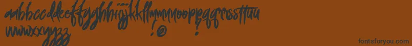 FoxingDemoVersion-Schriftart – Schwarze Schriften auf braunem Hintergrund