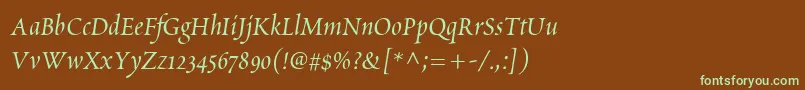 フォントScriptoriaSsi – 緑色の文字が茶色の背景にあります。