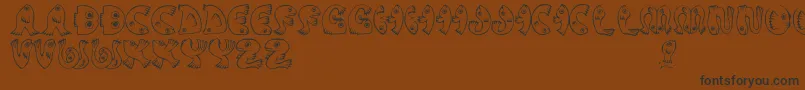 JmhPez Font – Black Fonts on Brown Background