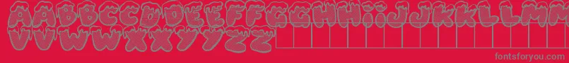Fonte XmasDad – fontes cinzas em um fundo vermelho