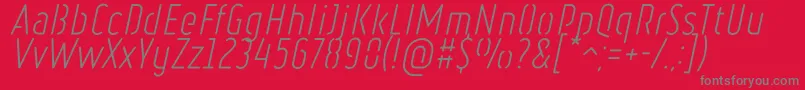 Czcionka RulerStencilLightItalic – szare czcionki na czerwonym tle