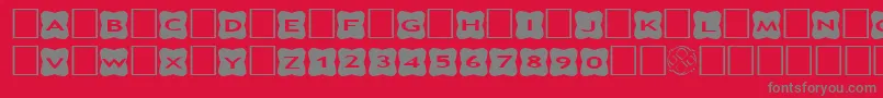 フォントAlphashapesCrosses3 – 赤い背景に灰色の文字