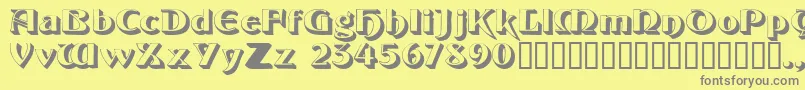 フォントObeliskssk – 黄色の背景に灰色の文字