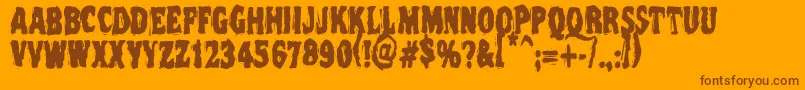Vtc Nightofthedeadcorruptcaps-Schriftart – Braune Schriften auf orangefarbenem Hintergrund