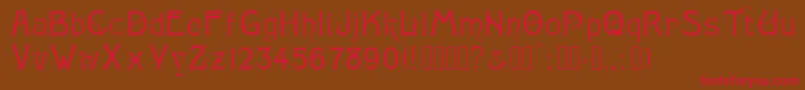 フォントMonopol – 赤い文字が茶色の背景にあります。