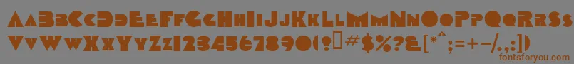 フォントTobagoscapssskBold – 茶色の文字が灰色の背景にあります。
