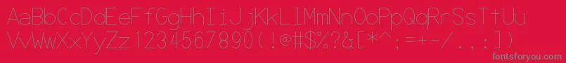 Czcionka Secrcode – szare czcionki na czerwonym tle