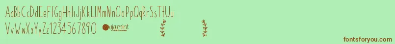 Czcionka PaperdaisyDemo – brązowe czcionki na zielonym tle