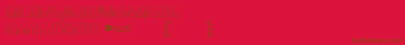 Fonte PaperdaisyDemo – fontes marrons em um fundo vermelho
