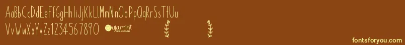 Czcionka PaperdaisyDemo – żółte czcionki na brązowym tle
