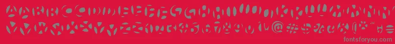 Fonte FrutigerstonesNegativ – fontes cinzas em um fundo vermelho