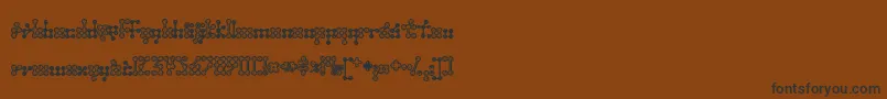 Wednesda-fontti – mustat fontit ruskealla taustalla