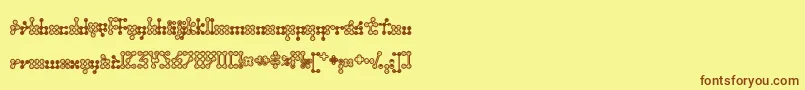 フォントWednesda – 茶色の文字が黄色の背景にあります。